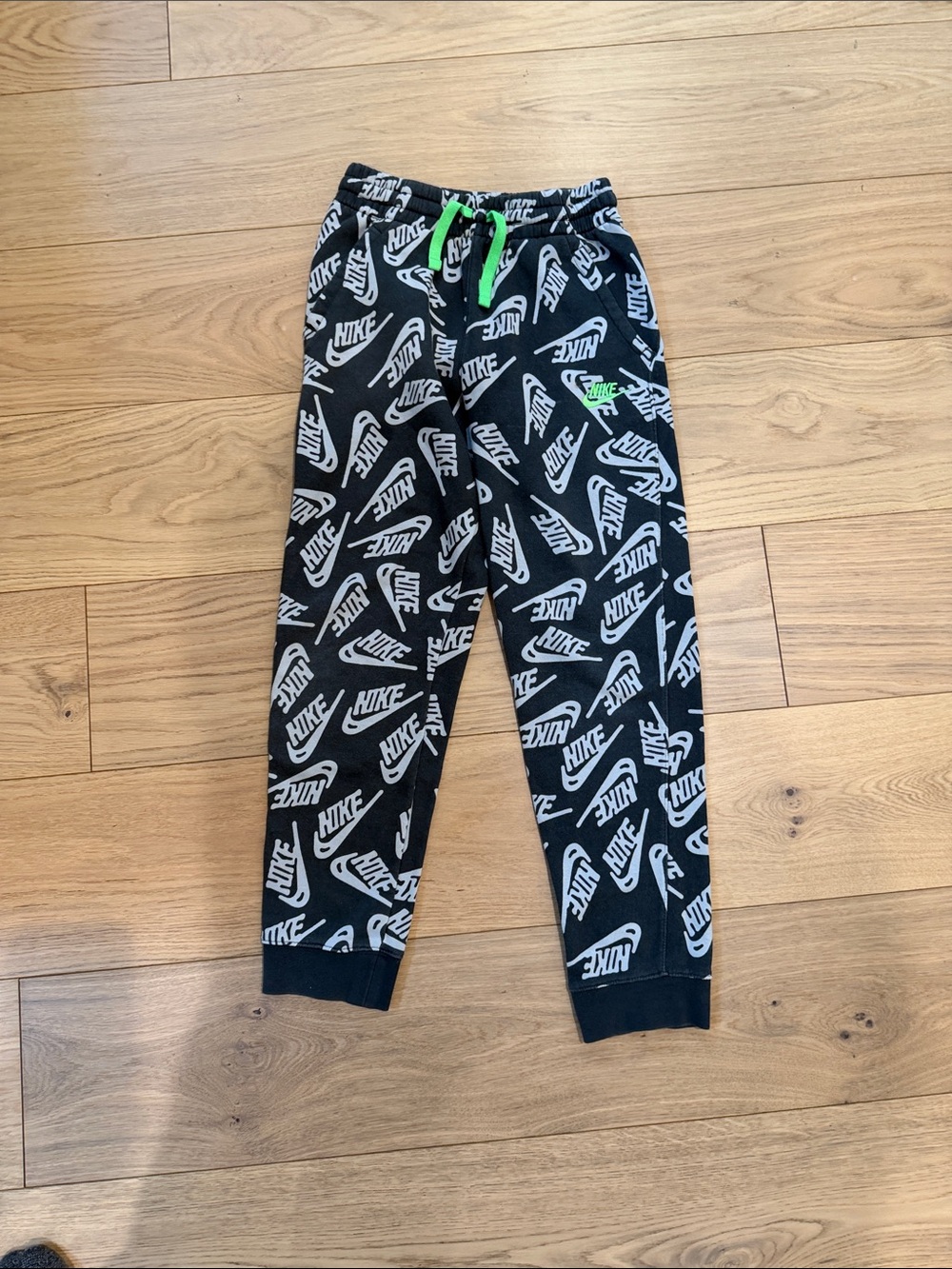 Nike Dark Grey Sweatpants with White Logo Pattern and Neon Green Drawcord